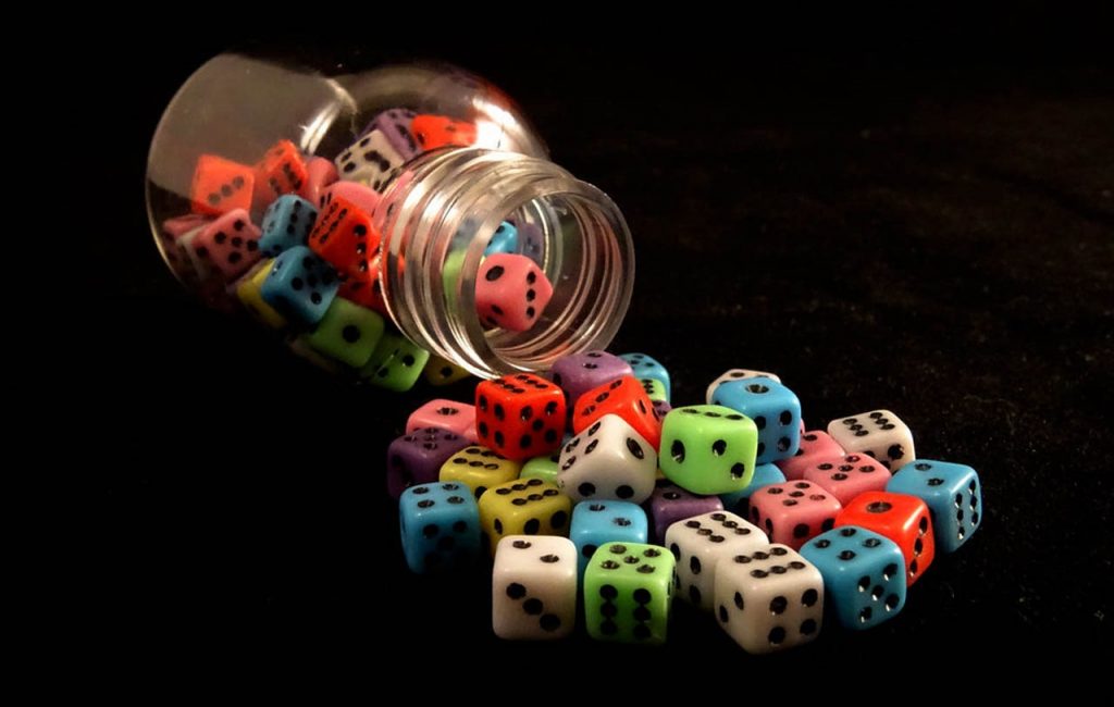 A large number of dice cubes scattered on the table